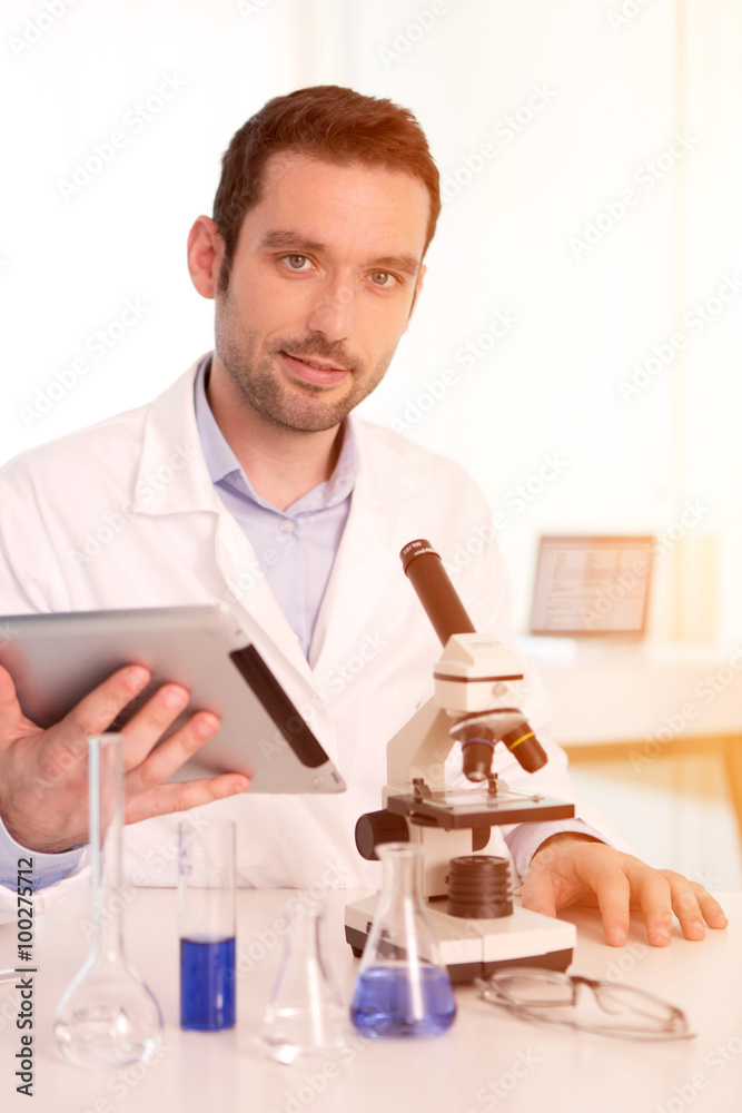 Young attractive man working in a laboratory Young attractive man working in a laboratory