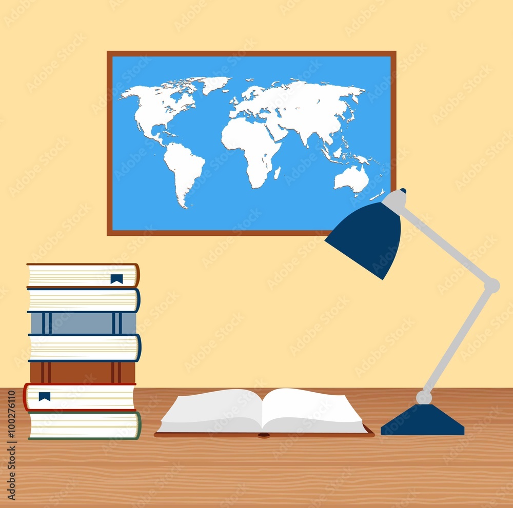 desk with lamp and stack of books against the background of the world map desk with lamp and stack of books against the background of the world map