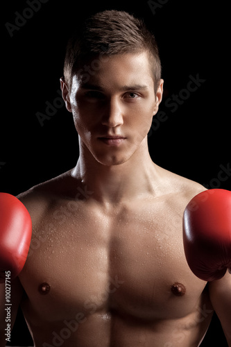 Attractive young sportsman is ready for box