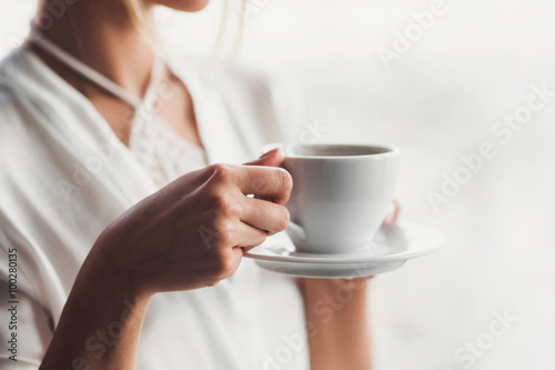Woman drinking coffee in the morning
