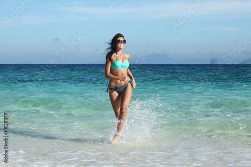 Woman run on beach © yellowj