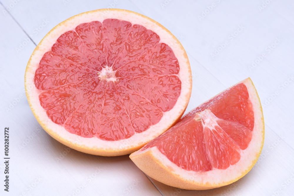 Red grapefruit on a wooden background Red grapefruit on a wooden background