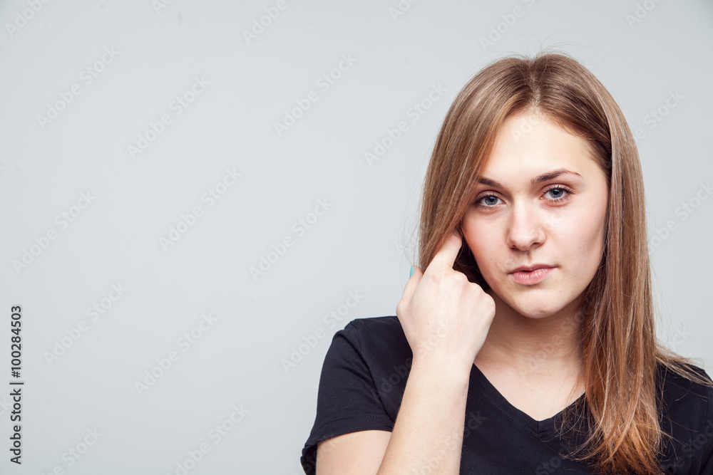 Attractive woman with black t-shirt isolated on a over white background Attractive woman with black t-shirt isolated on a over white background