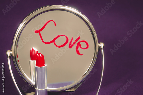 The inscription on the mirror written in lipstick