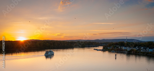 Ottawa Riverboat sunset.  Dusk falls over the city and river as riverboats of tourists enjoy the evening.