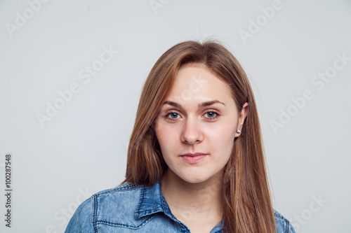 Portrait of a girl in a blue denim dress - isolated on white background