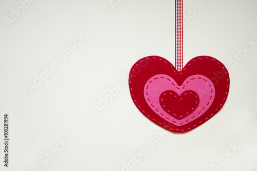 Red and Pink Heart Felt On White Background