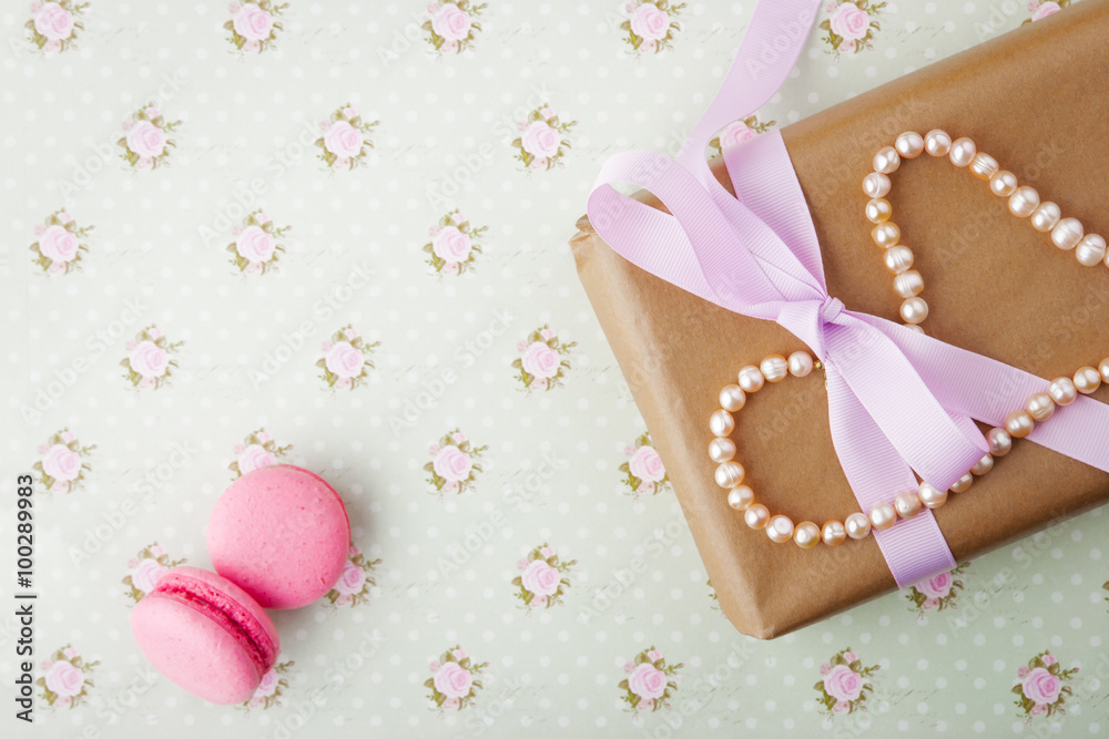 Gift box with pearls in a romantic vintage style in pastel color