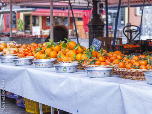 NICE, FRANCE, on JANUARY 7, 2016. Counters with various vegetables and fruit in the Cours Saleya market photo