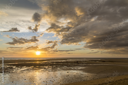 Yellow african sunset on a plain beach