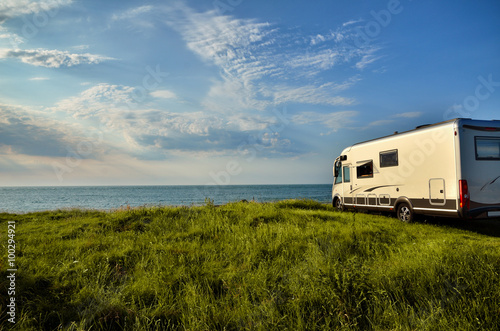 Recreational vehicle in a meadow photo