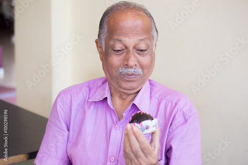 Canvas Print Closeup portrait of elderly gentleman in pink shirt craving dessert, eager to ea