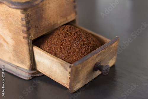 Close up of open drawer of coffee grinder