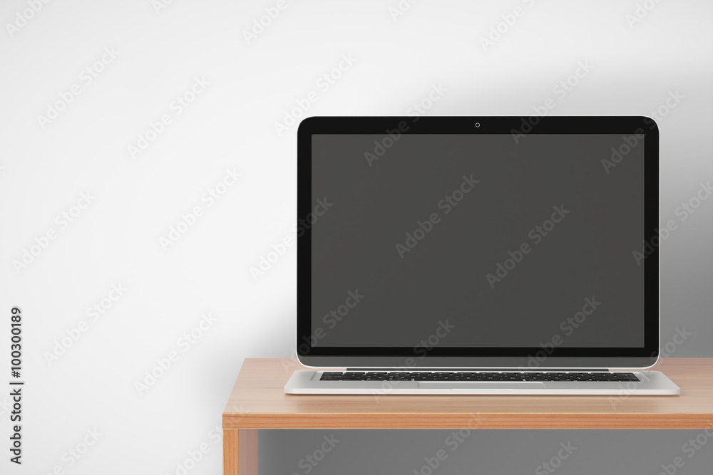 Blank laptop on a wooden shelf, mock up Blank laptop on a wooden shelf, mock up