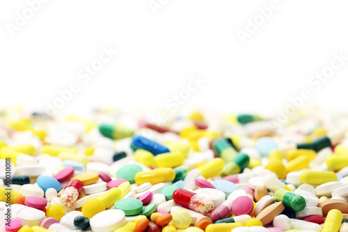 Colored pills on a white background