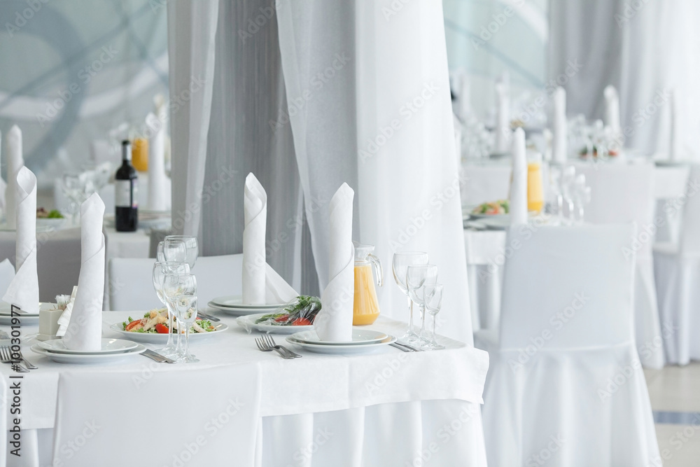 White restaurant interior. Table layout. Stock Photo Adobe Stock