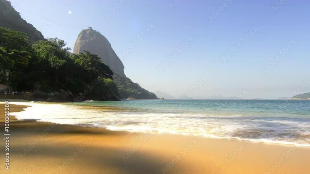 Static shot of gentle waves washing up on Red Beach in Rio.