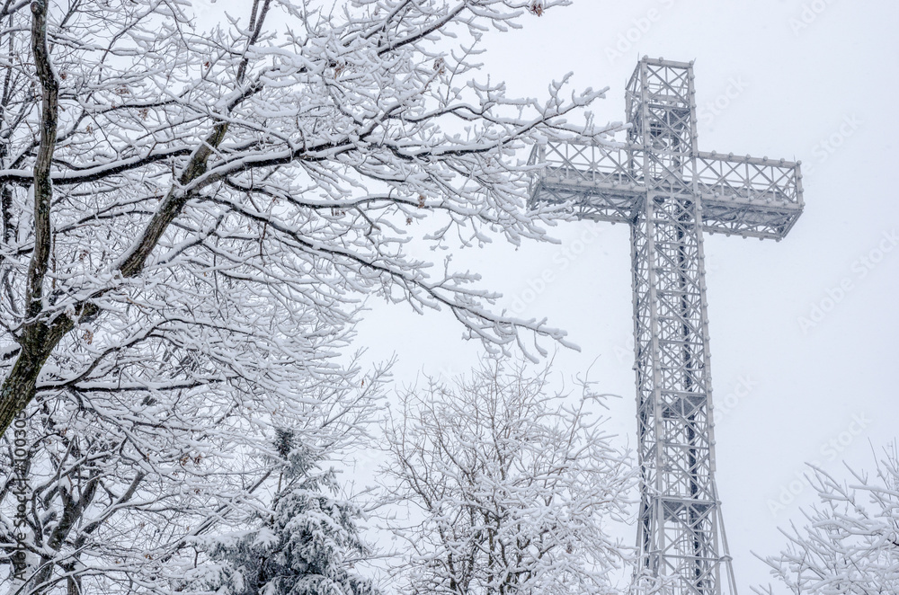 Montreal Mont-Royal Cross during snow storm, in Winter. Montreal Mont-Royal Cross during snow storm, in Winter.