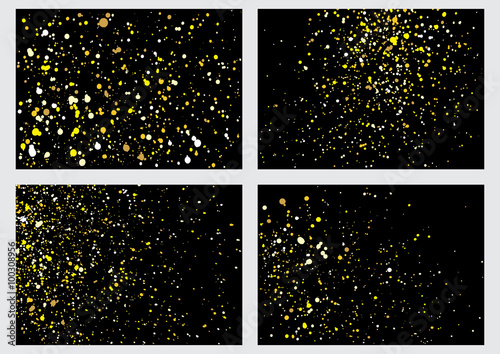 Gold glitter explosion set on black background made of spray paint. Collection of golden festive blow texture of confetti. Golden grunge grainy spray abstract texture of snowflakes. Winter Holiday.