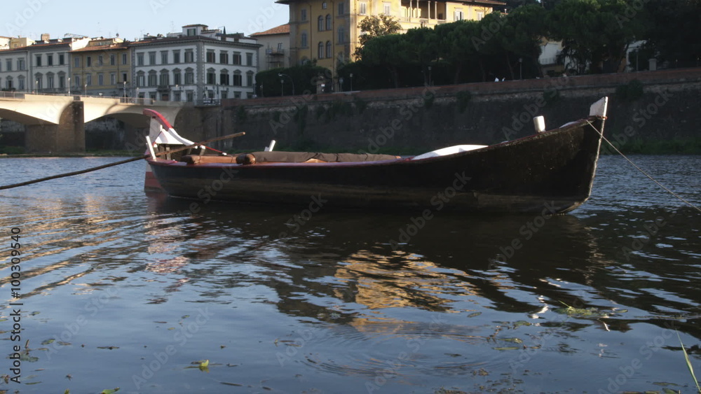 Small boat docked on calm water in Italy. Small boat docked on calm water in Italy.