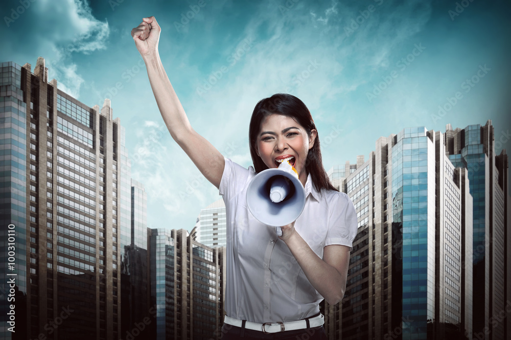 Fotografie Business woman using megaphone