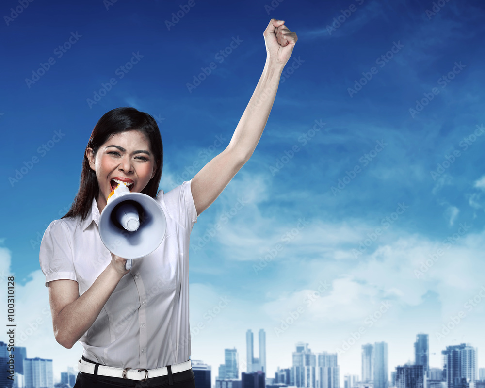 Fotografie Business woman using megaphone