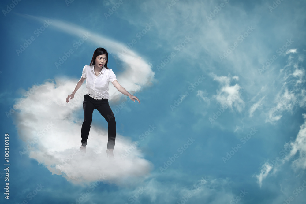 Asian business person flying with the cloud