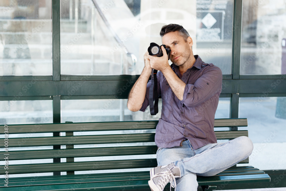 Fototapeta premium Male photographer taking picture