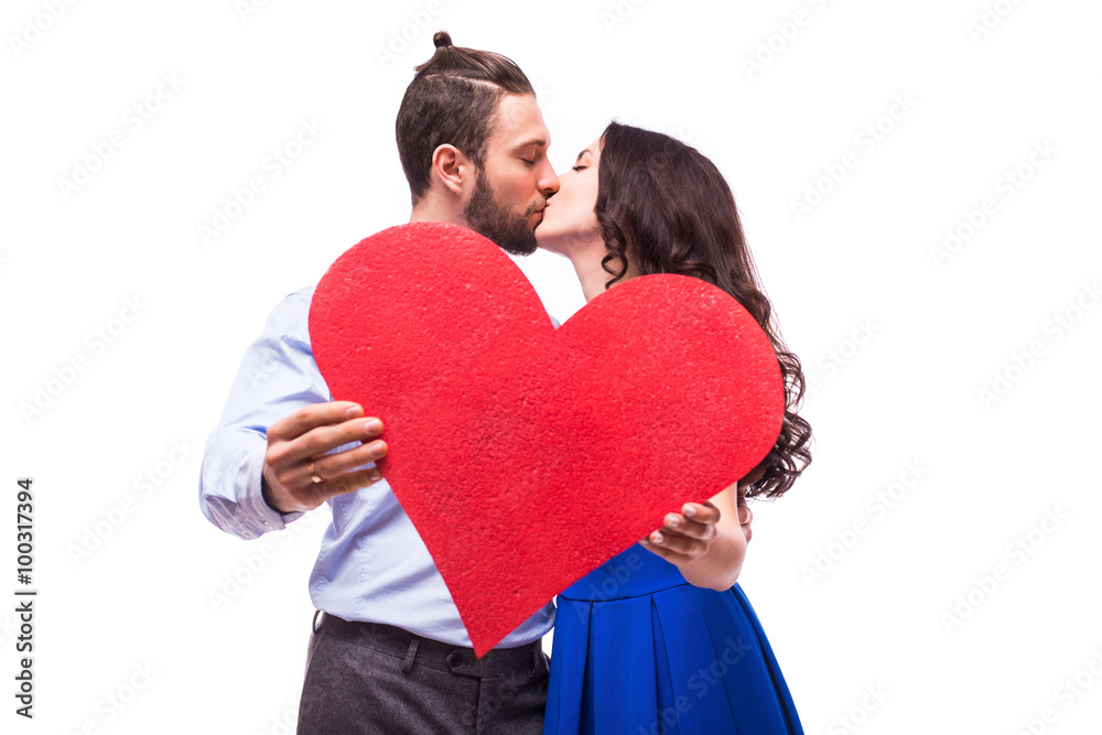young happy smiling Couple  holding heart  on white background