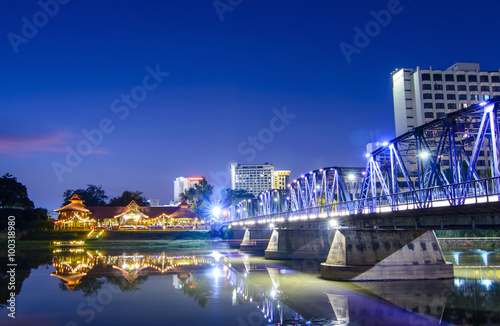 Iron bridge At twilight time Chiangmai in Thailand , With Lens F © kuarmungadd