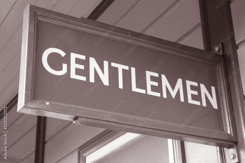 Obraz premium Green Gentleman Toilet Sign against Yellow Background