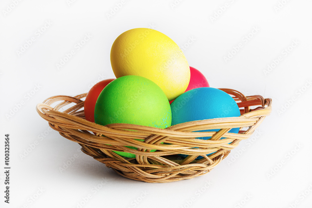 Colorful easter eggs in a wicker basket. Colorful easter eggs in a wicker basket.