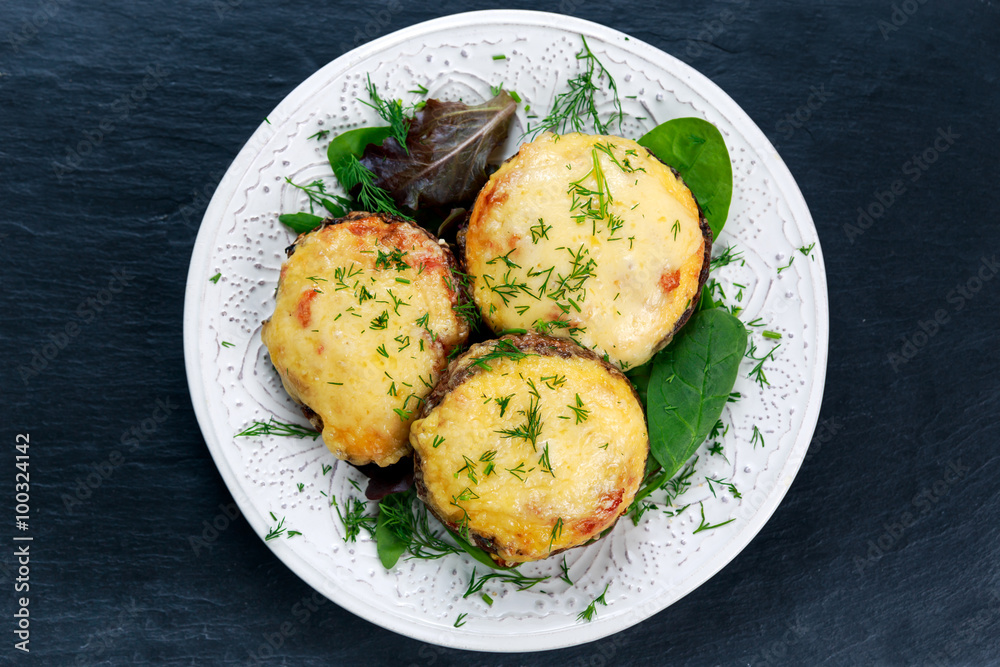 Cooked Mushrooms with vegetables and cheese. Cooked Mushrooms with vegetables and cheese.