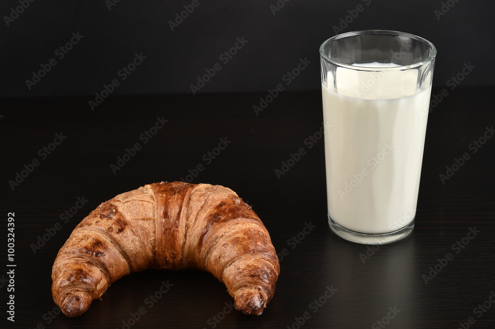 Glass of milk and croissant for breakfast - isolated on black
Glass of milk and croissant for breakfast - isolated on black