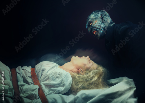 Nightmare. Insane woman and her inner monster photo