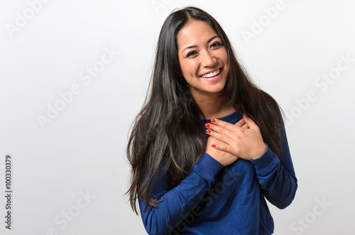 Young woman showing her heartfelt gratitude photo