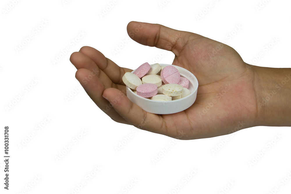 Vitamin C tablets on hand isolated on white Vitamin C tablets on hand isolated on white