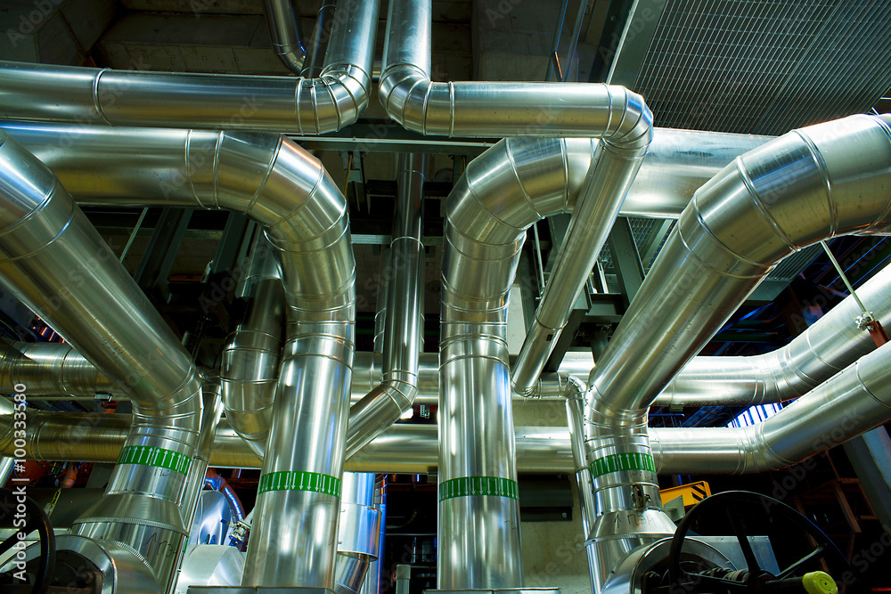 different size and shaped pipes and valves at a power plant different size and shaped pipes and valves at a power plant