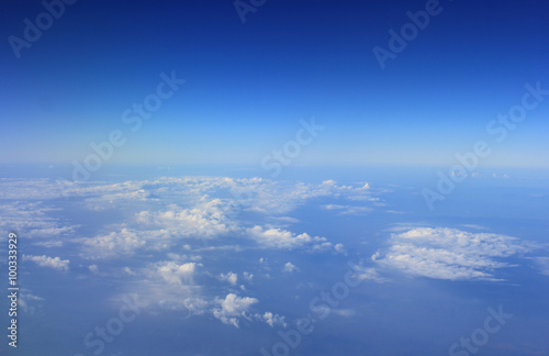 Blue sky and Cloud Top view from looking through window aircraft
