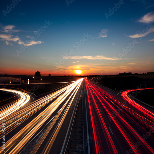 Speed Traffic long exposure on motorway highway at sundown