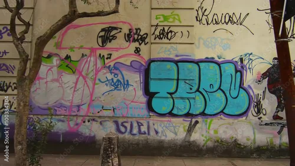 Tracking shot of a wall covered in graffiti in Rio de Janeiro, Brazil
