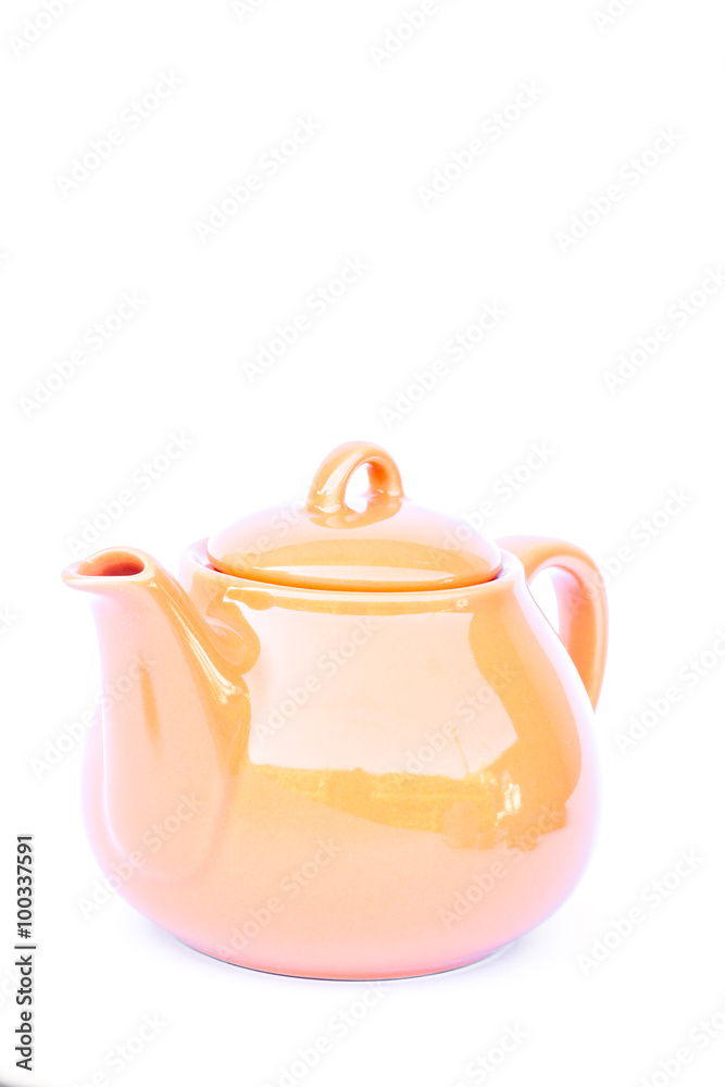 Orange ceramic teapot isolated on white background Orange ceramic teapot isolated on white background