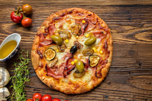 Delicious italian pizza served on wooden table #100337532