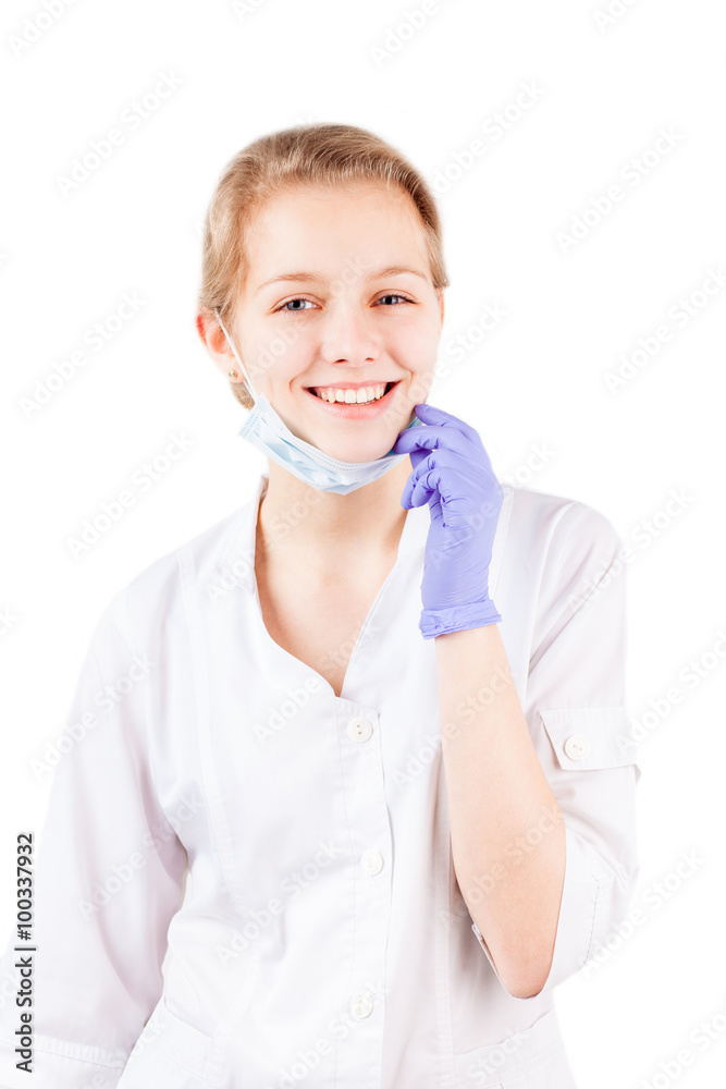 Smiling medical doctor woman taking off mask isolated Smiling medical doctor woman taking off mask isolated