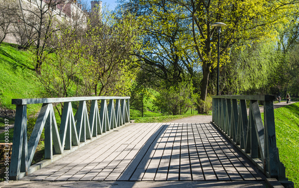 Wooden bridge in the park in Tallinn, a beautiful spring day