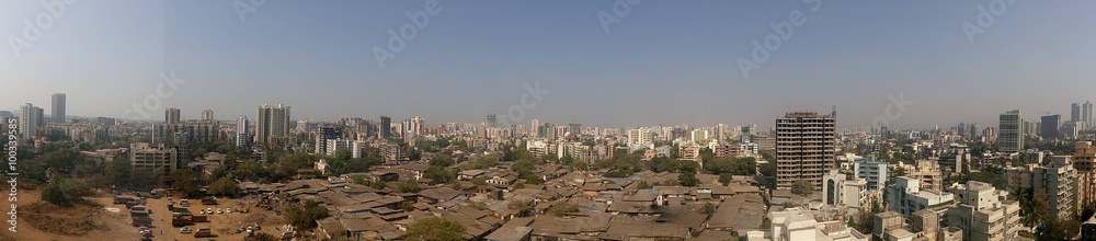 Panoramic shot of cityscape against clear blue sky