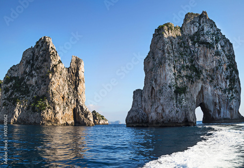 Amazing landscape at Capri Island with Faraglioni - coastal rocks formation at the Mediterranean Sea.