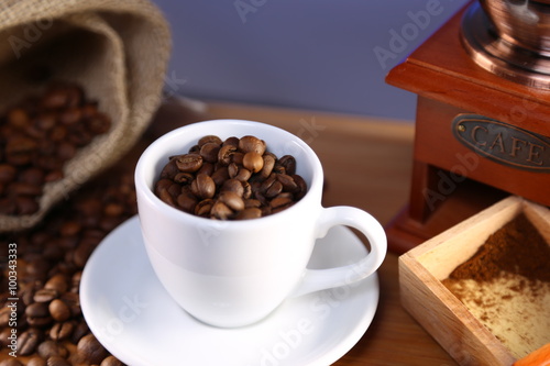 manual coffee grinder  beans and cup