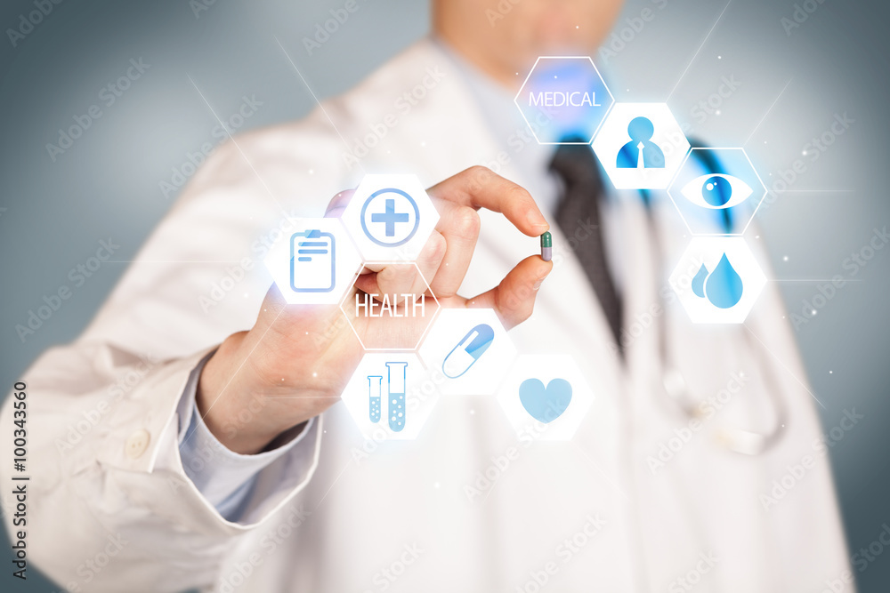 A doctor in white holding a pill A doctor in white holding a pill