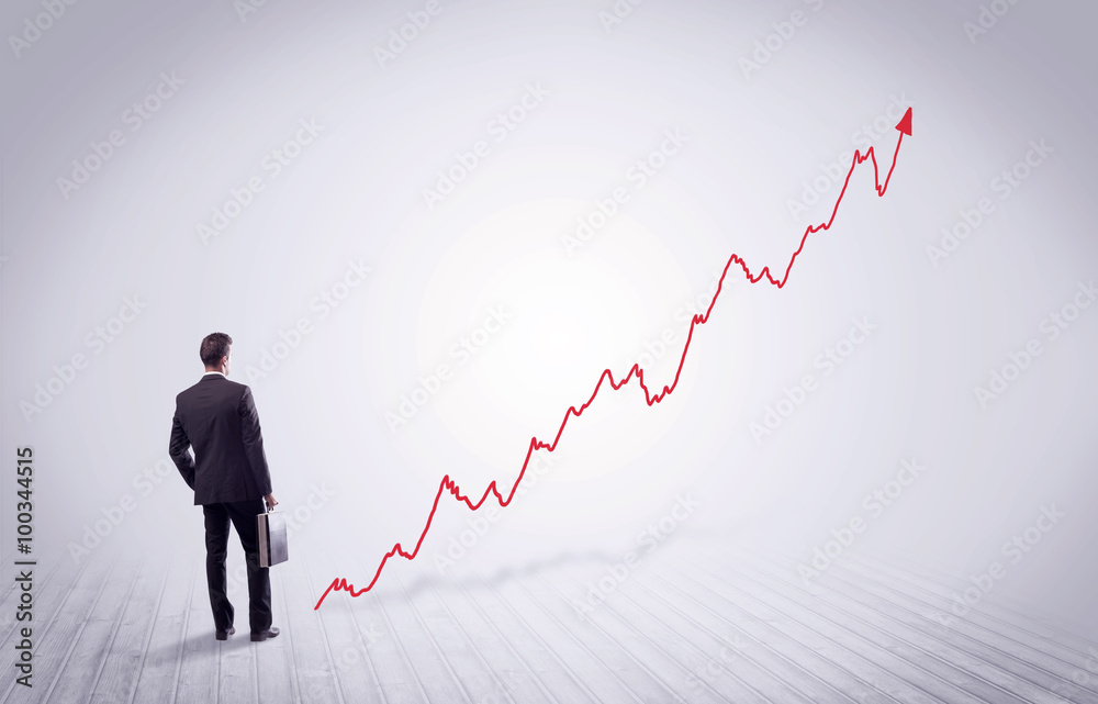 Standing businessman with red graph arrow Standing businessman with red graph arrow